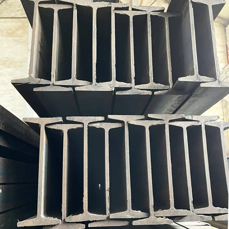 Factory-direct carbon steel I beams in bulk storage for immediate delivery to construction and manufacturing industries
